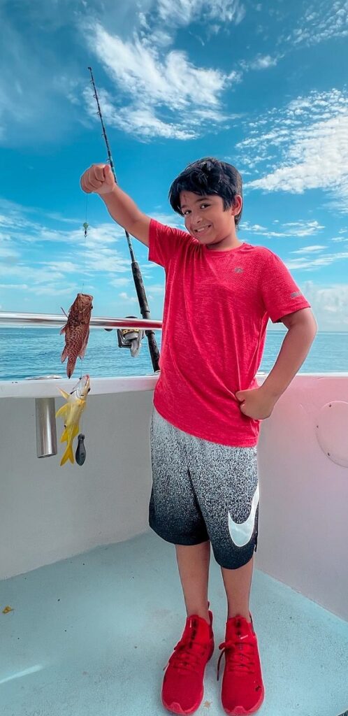 Student with his fishing catch.